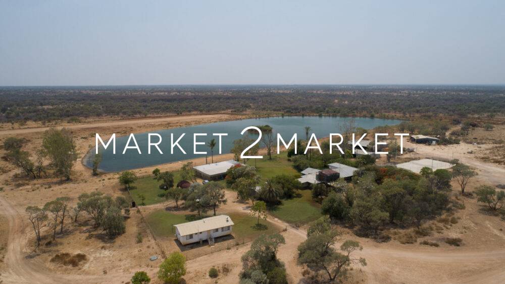 Aerial view of small lake and regional properties in North Queensland